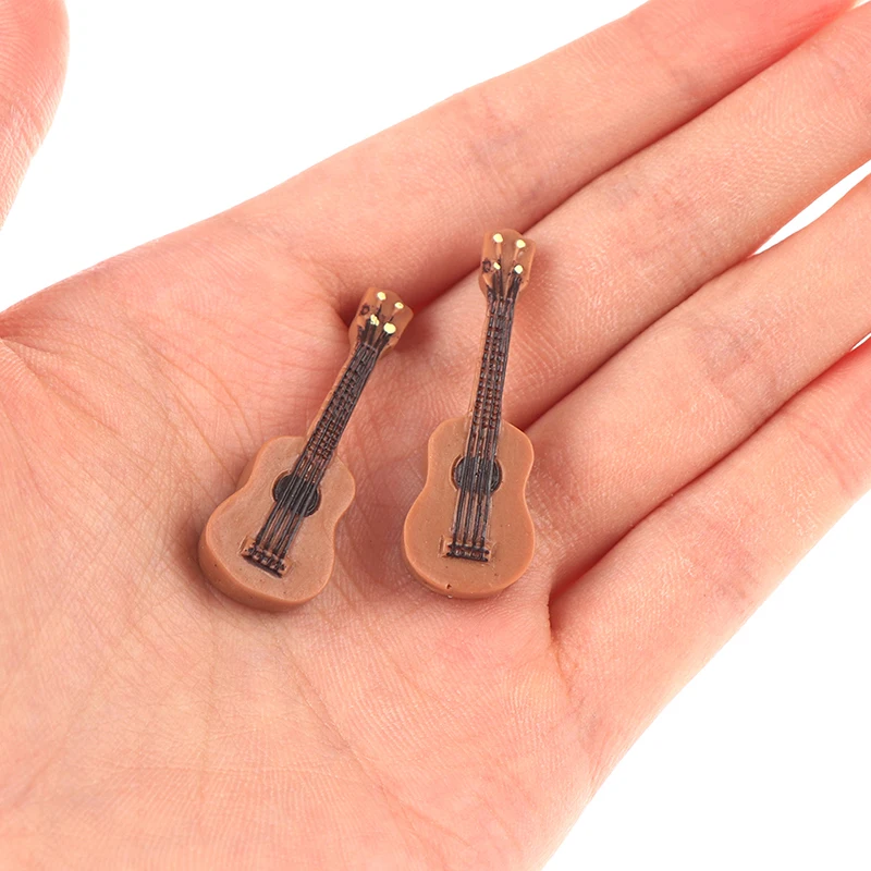 

1pc Mini Fashion Cool Dollhouse Miniature Musical Guitar For doll s Dolls Accessories Christmas Children's Day Gifts