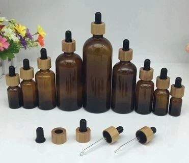 Пользовательский гравировальный логотип Экологичная косметическая упаковка для ухода за кожей контейнер CBD стеклянная бутылка-капельница 30 мл с бамбуковой крышкой 1 унц