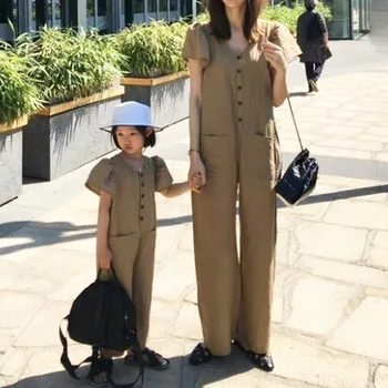 

Summer 2020 Korean children's clothing new fashion bubble shoulder pocket button casual jumpsuit
