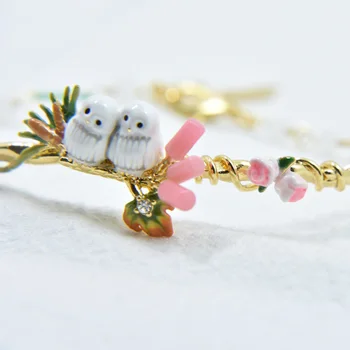 

flowers nestled owl bangle bracelet