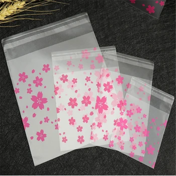 Sacchetto di imballaggio regalo in plastica imballaggio di biscotti forniture per la cottura del pane fiori di ciliegio pacchetto di biscotti di caramelle matrimonio per feste 100 pezzi