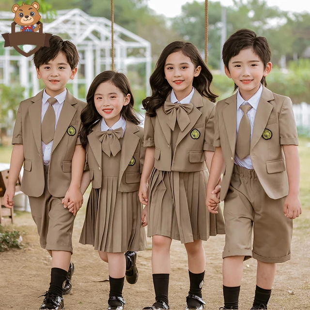 Cute little indian Indian / Asian school boy wearing uniform Stock Photo |  Adobe Stock