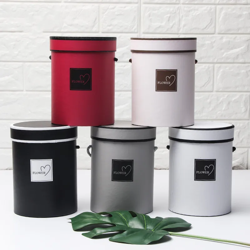 

2018 new paper gift bags for flower packaging gift boxes round flower paper boxes with lid hug bucket packaging boxes material