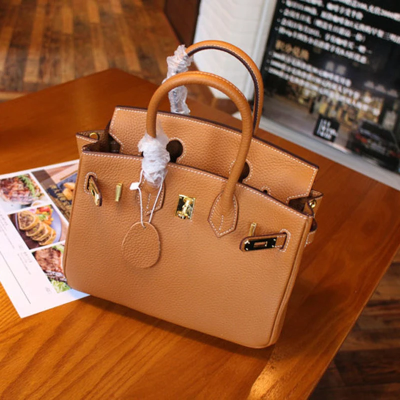

Top Quality Genuine Leather Gold Matel Elegant Woman Handbag 100% Real Leather Woman Handbag also have Black Blue many colors