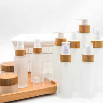 

New products wholesale empty 30ml 50ml 100ml 120ml 150ml cosmetic frosted glass bottle with bamboo caps,perfume bamboo spray cap