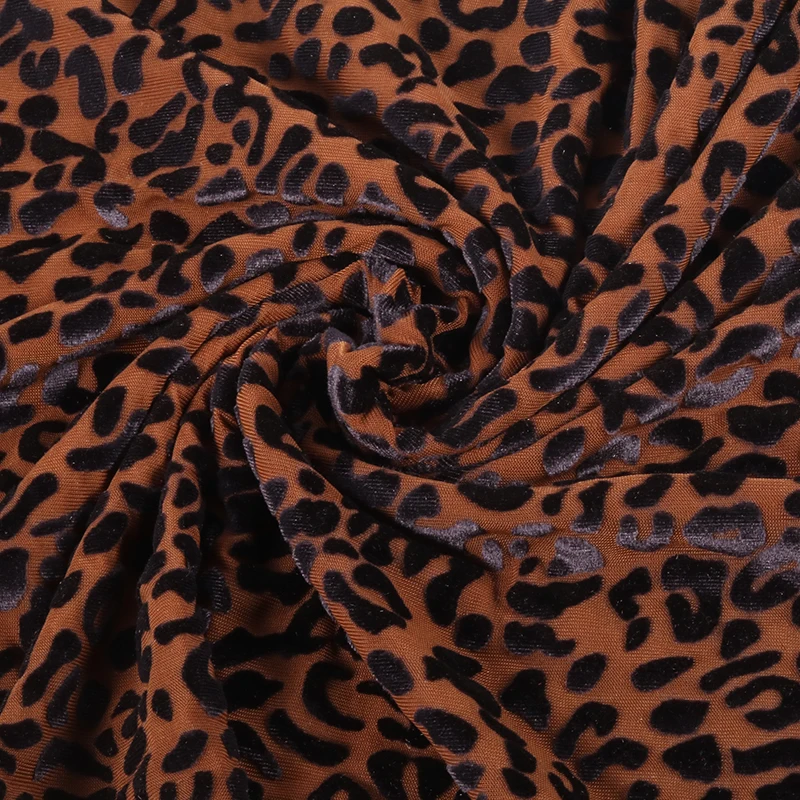 

Knitted burnout velvet fabric with leopard base and surface pattern black dot of leopard for stage costumes party dress garments