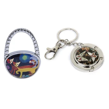 

Yellow Orange Oval Metal Foldable Handbag Purse Table Hook Hanger Holder & Bag Holder Butterfly Model with Keychain