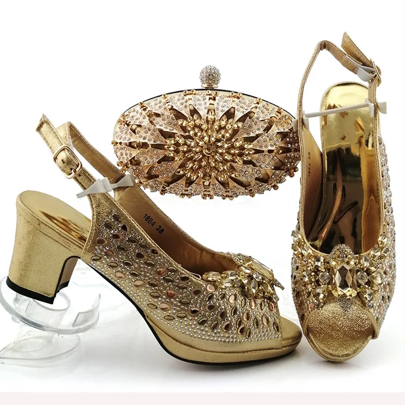 gold heels and clutch bag