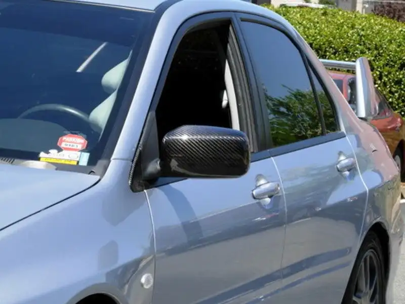 

Carbon Fiber Tape-on Mirror Covers for 2003-2007 Mitsubishi Lancer EVO 7 8 9 Ralliart