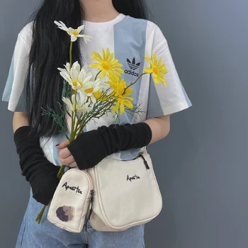 

2020 New Japanese Harajuku Student Literary Retro Canvas Bag Female Korean Version Wild Ins Messenger Small Bag White Armpit Bag