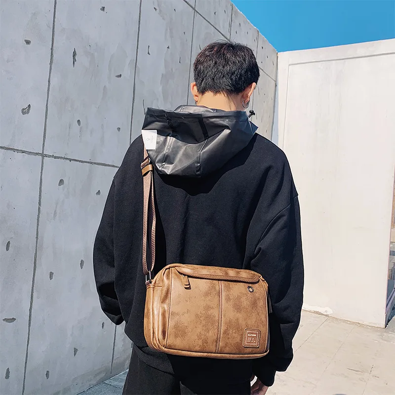 

Leisure tide bag men's shoulder messenger bag Korean version of simple tide brand large capacity chest bag backpack leather