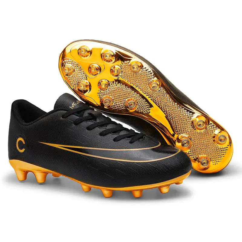 boys black and gold football cleats