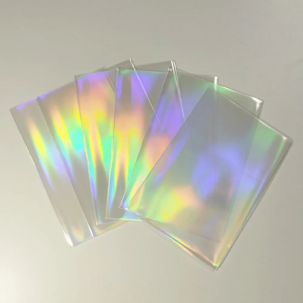 100Pcs/lot 57x89 Laser Rainbow Hologram Clear Cards Sleeves Shinning Gaming  Foil Card Cover for Star Idol Cards Album Post Cards - AliExpress