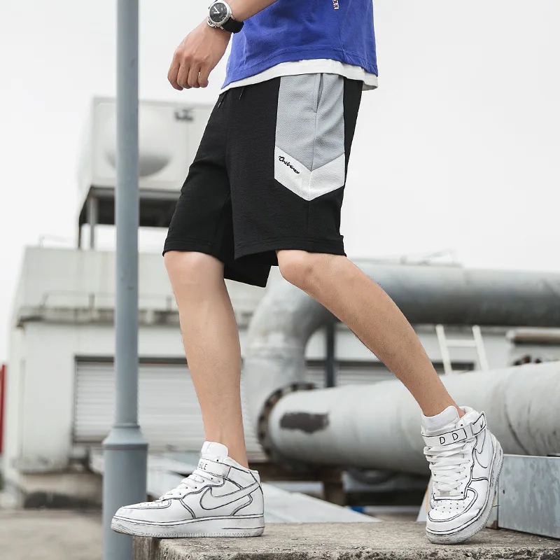 Мужская новая двухцветная модная трендовая летняя модель года, красивые, свободные и повседневные Лоскутные шорты