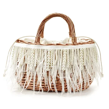 

Early autumn 2020 new beige pearl tassel ostrich fur straw woven bag portable rattan bag travel holiday female bag