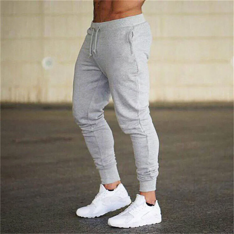 Мужские новые удобные спортивные брюки, мужские повседневные весенние и осенние Однотонные эластичные хлопковые длинные штаны с поясом
