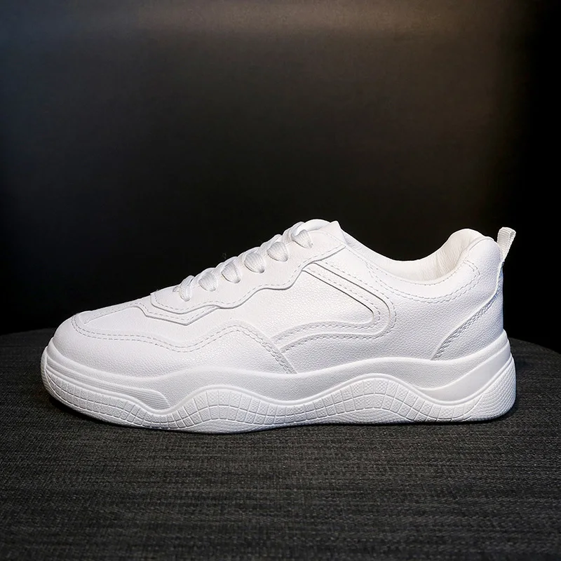 white flat tennis shoes