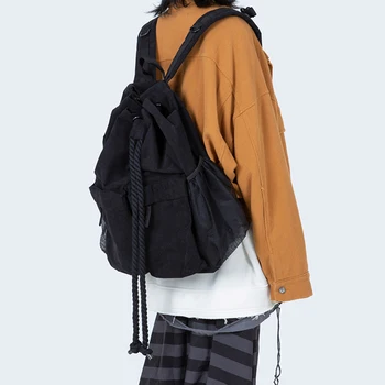 

female backpack Korean niche drawstring strap large-capacity backpack men and women retro casual rucksack simple wild school bag