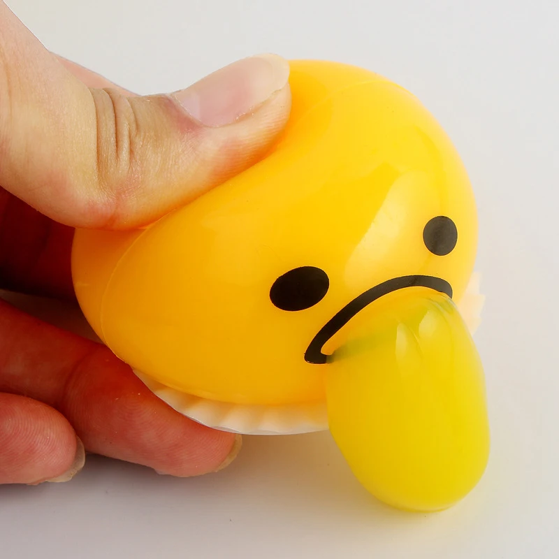 squishy puking egg yolk stress ball with yellow goop