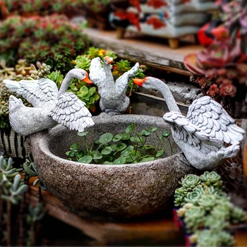 

Three Swans Stand On Flower Pots With Wings Spread Out Sculpture Flowerpot Green Rose Window Succulent Home Garden Decoration