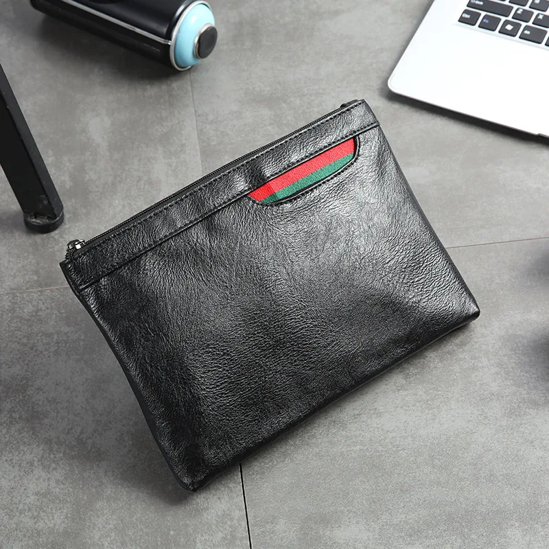 

The Korean version of the street hand bag casual wrist bag men's new youth minimalist Joker men's and women's hand bag