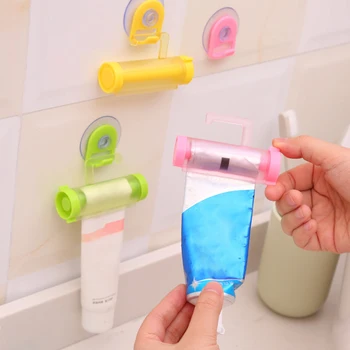 

Toothpaste Dispenser Manual Syringe Gun Dispenser Portable Plastic Rolling Tube Squeezer with Sucker Hook Bathroom Accessories