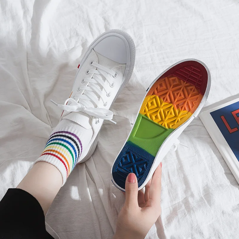 white sneakers with rainbow soles