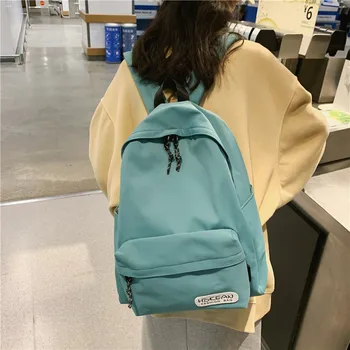 

Schoolbag female Korean high school junior high school student large capacity simple solid color double backpack