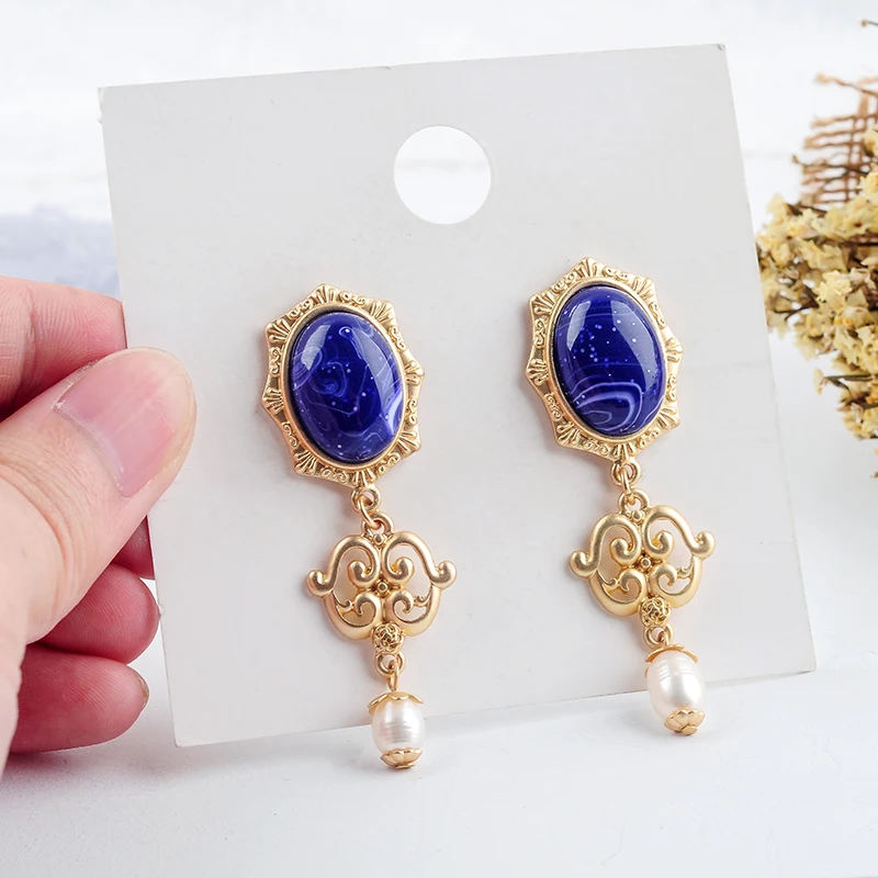

Luxury Gold Color Hollowed Alloy Decorative Pattern Purple Resin Imitation Pearl Drop Earrings Fashion Women Jewelry Wholesale