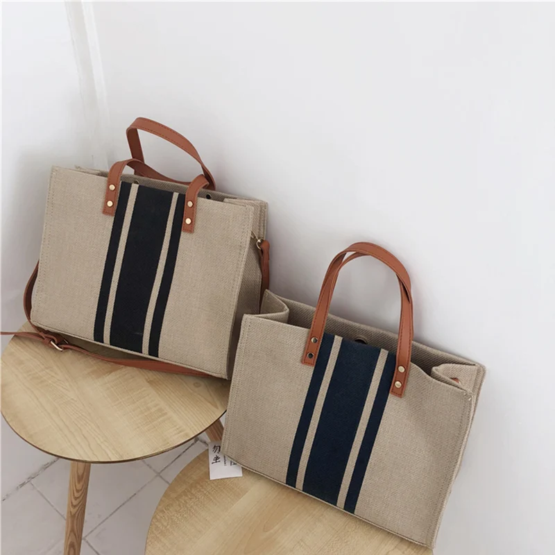 

Striped canvas handbag 2019 new shoulder bag Korean version of the tide multi-function large capacity commuter package