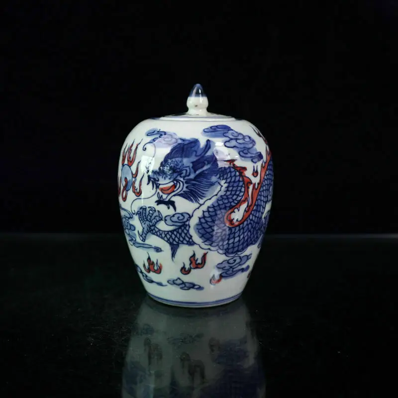 

Chinese old porcelain Blue and white glaze in red dragon lid jar Receiving pot