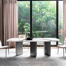 

Light luxury marble dining table and chairs combination of simple household round dining room dining table