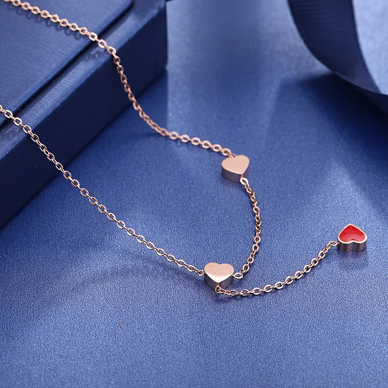 

JeeMango Titanium Steel Red Glaze Love Heart Charm Necklaces Female Rose Gold Clavicle Chain Pendant Necklace For Girls RN02300
