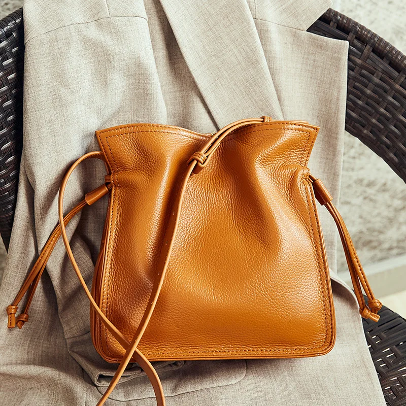 

women Leather Bags New Style Bucket Bag Full-grain Leather women Shoulder Department Drawstring Buckle Shoulder women Bag 1242