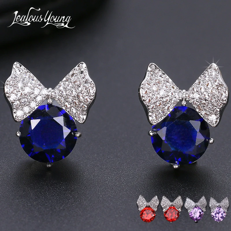 Женские сережки гвоздики серебряного цвета с бантом и блестящим цирконием