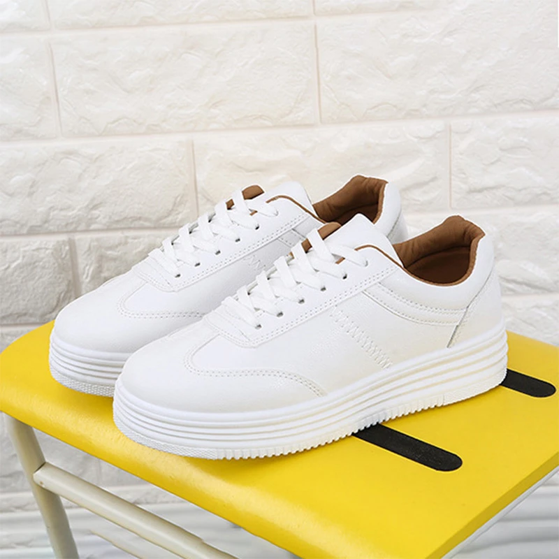 white flat tennis shoes