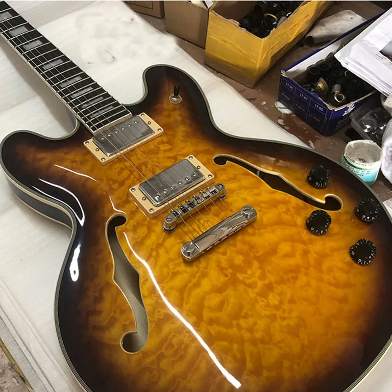 

Factory Outlet 6 string electric guitar, flocculent large flower veneer, half empty core F hole electric guitar, real photos, po