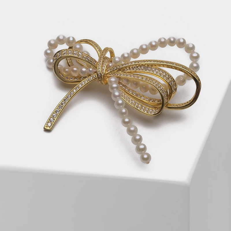 

Bow design natural pearl fashion brooch