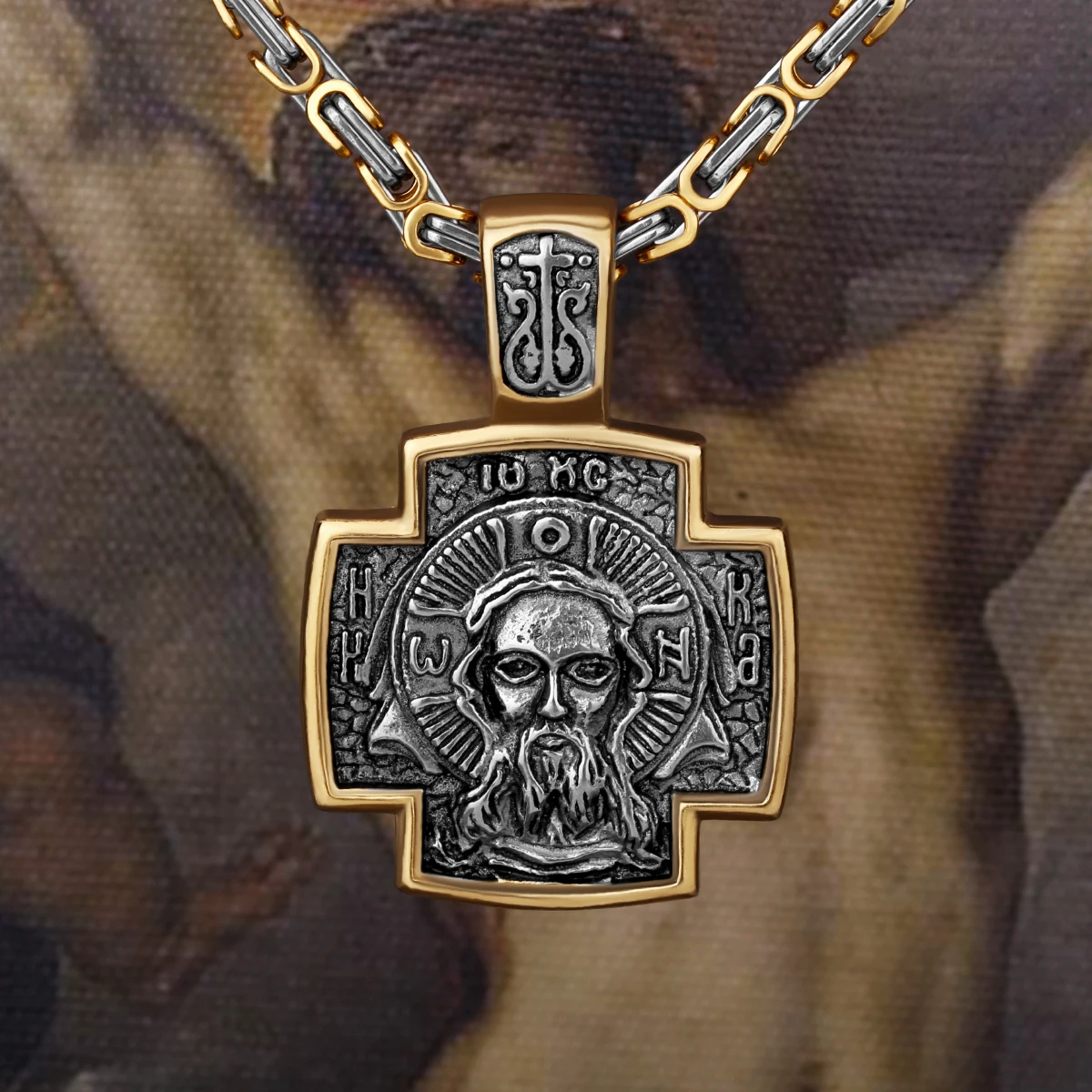 Edler Herrenschmuck Jesus Kreuz auf künstlerischem Hintergrund.