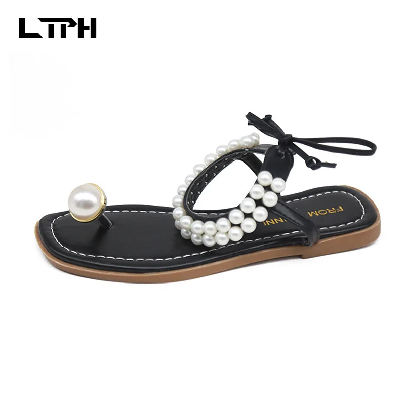 

Free shipping 2020 summer new ins tide Korean version of the net red wild sweet pearl clip toe strap holiday style flat sandals