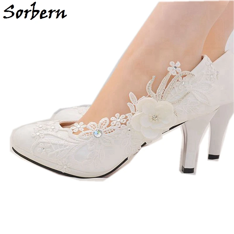 white pumps with flowers