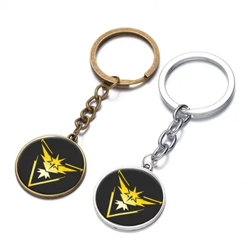 

24Pcs/Lot Glass Jewelry Pokemon GO Valor Instinct Mystic Cabochon Keychain Pocket Monster Yellow Logo Chaveiro Key Chain Ring