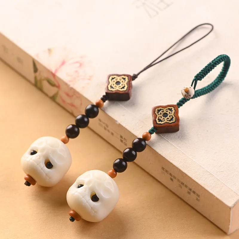 

Chinese element creative white bodhi root carving dumb mobile phone chain mobile phone pendant personality creative cute gift
