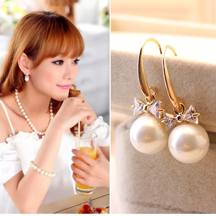 

Korean fashion personality wild alloy inlaid pearl bow earrings wholesale