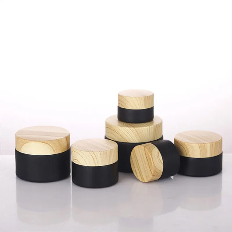 

Wholesale 5g-50g Glass Empty Jars Mini Pots Matte Black Cosmetic Face Cream Lip Balm Containers Wood Refillable Bottles