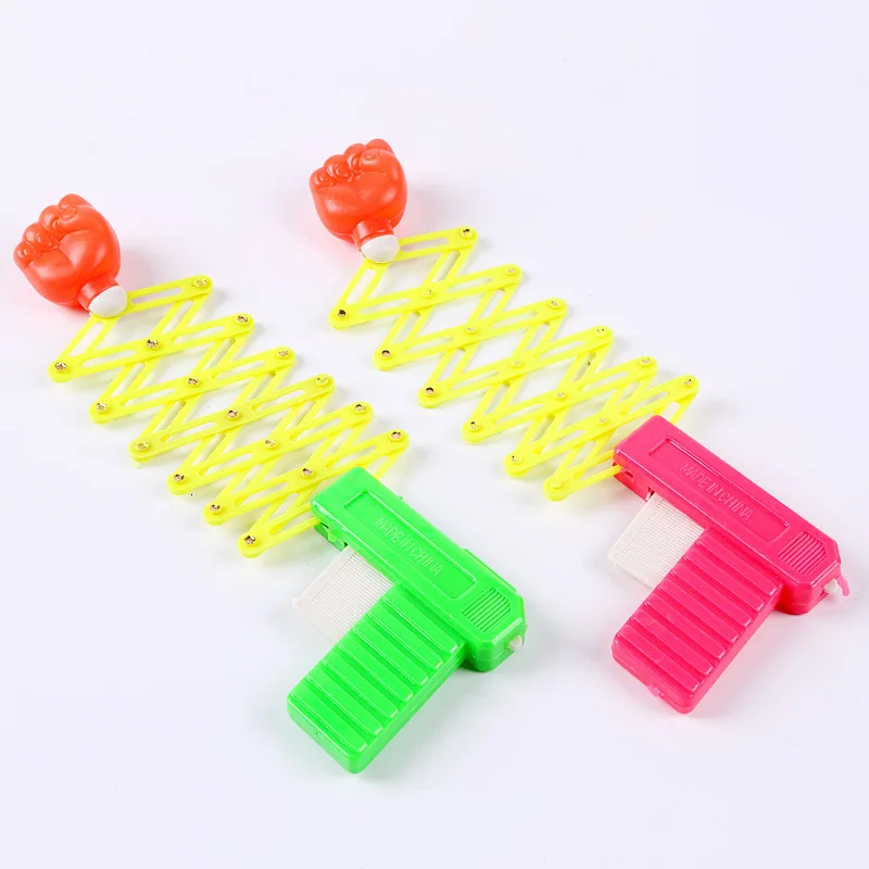

Practical Jokes Toys For Children Prank Elastic Spring Fist Weapon Funny Children Toys Plastic Gun Kids Gift