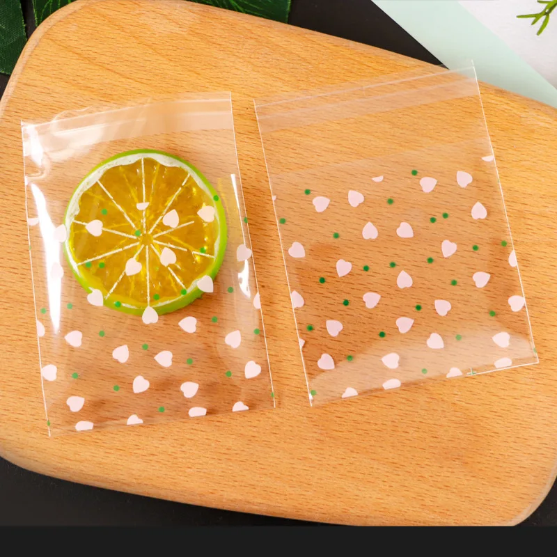 100Pcs Heart Shaped Transparent Candy Bag Biscuit Snacks Plastic Bag Baking Decoration Packaging DIY Self-adhesive plastic packaging bags