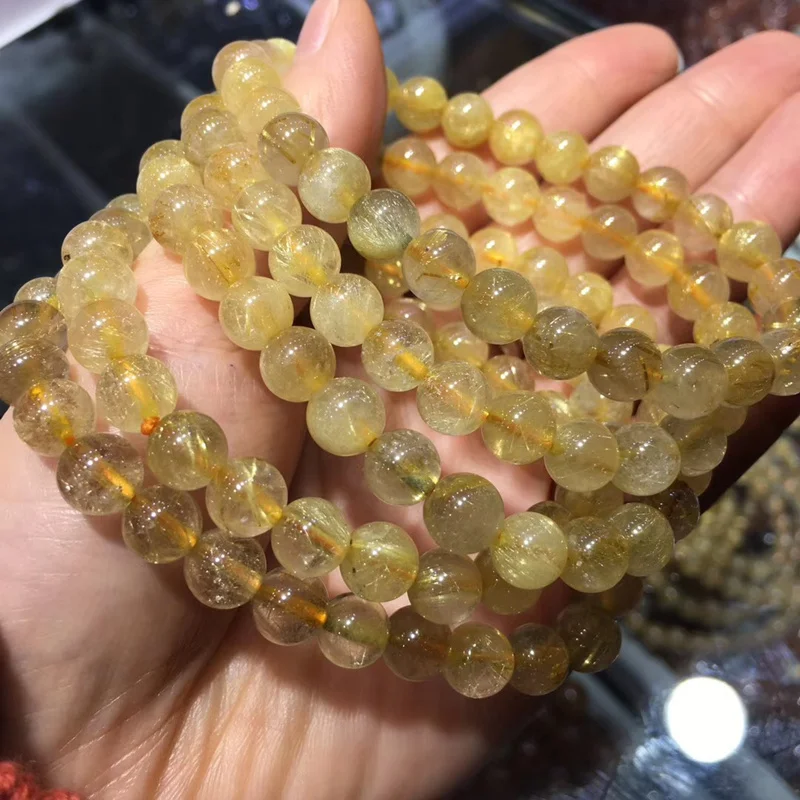 

Natural Golden Hair Crystal Hand Chain with Brazilian Titanium Crystal Yellow Crystal