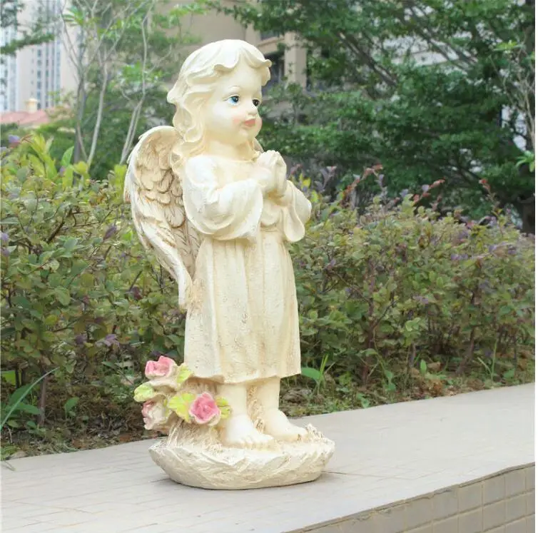 Statue Ange jardin Posée