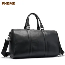 

PNDME high quality genuine leather men's women's travel bag handbag casual simple cowhide waterproof black large duffel bag